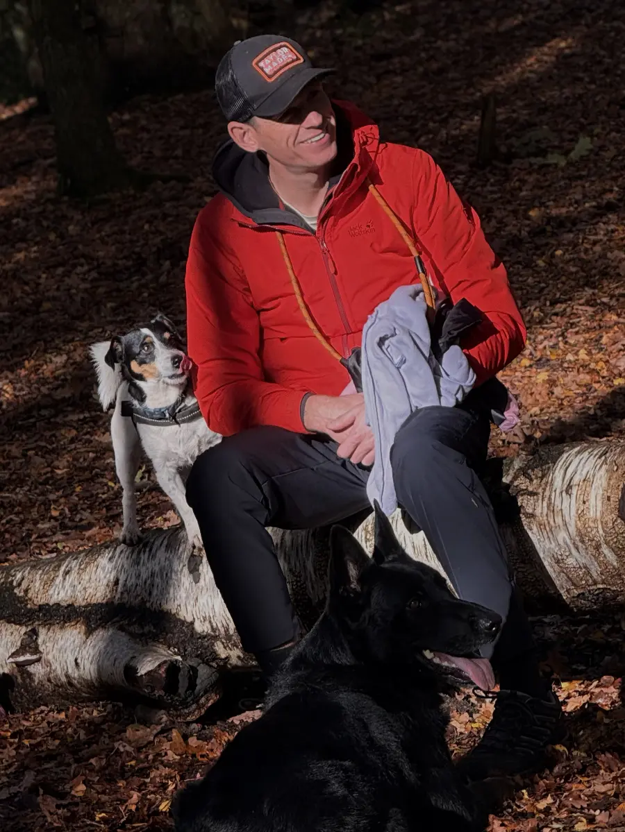 David O'Sullivan with his dogs in autumn woodland